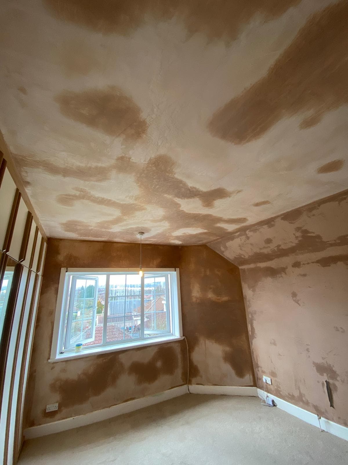 Patched ceiling and walls after plastering