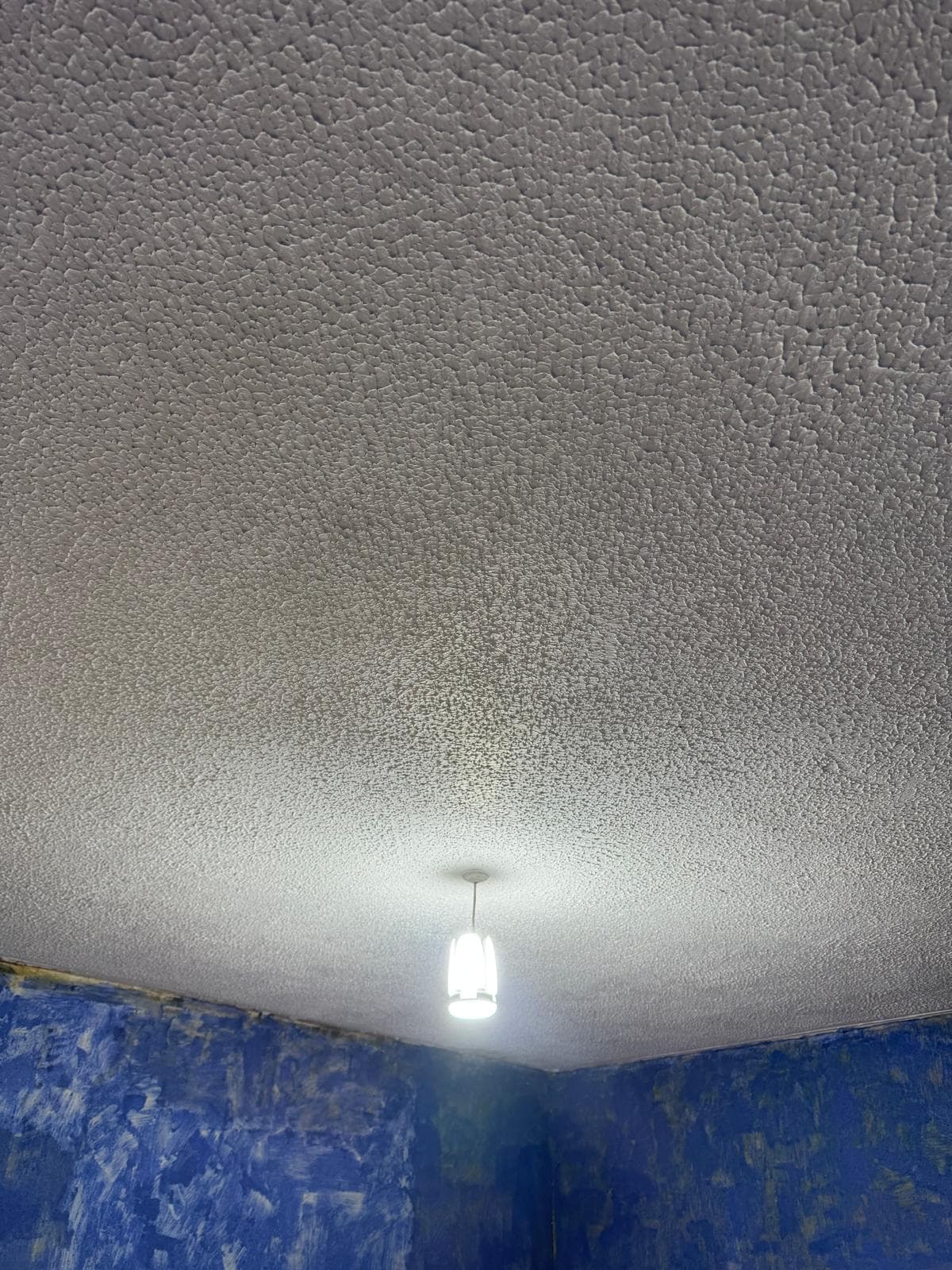 Textured Artex ceiling before it is covered