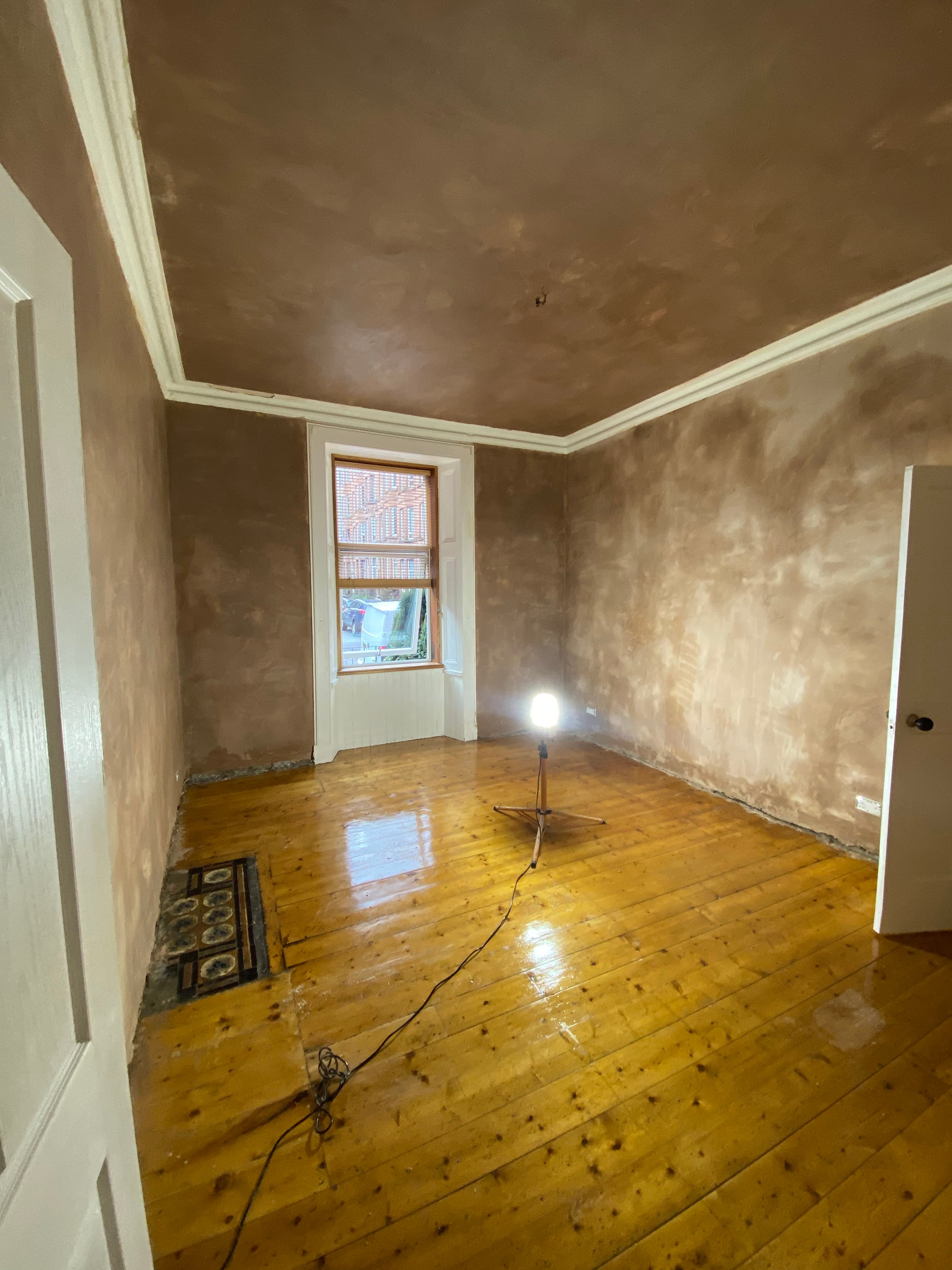 Patched wall blended into the existing plaster