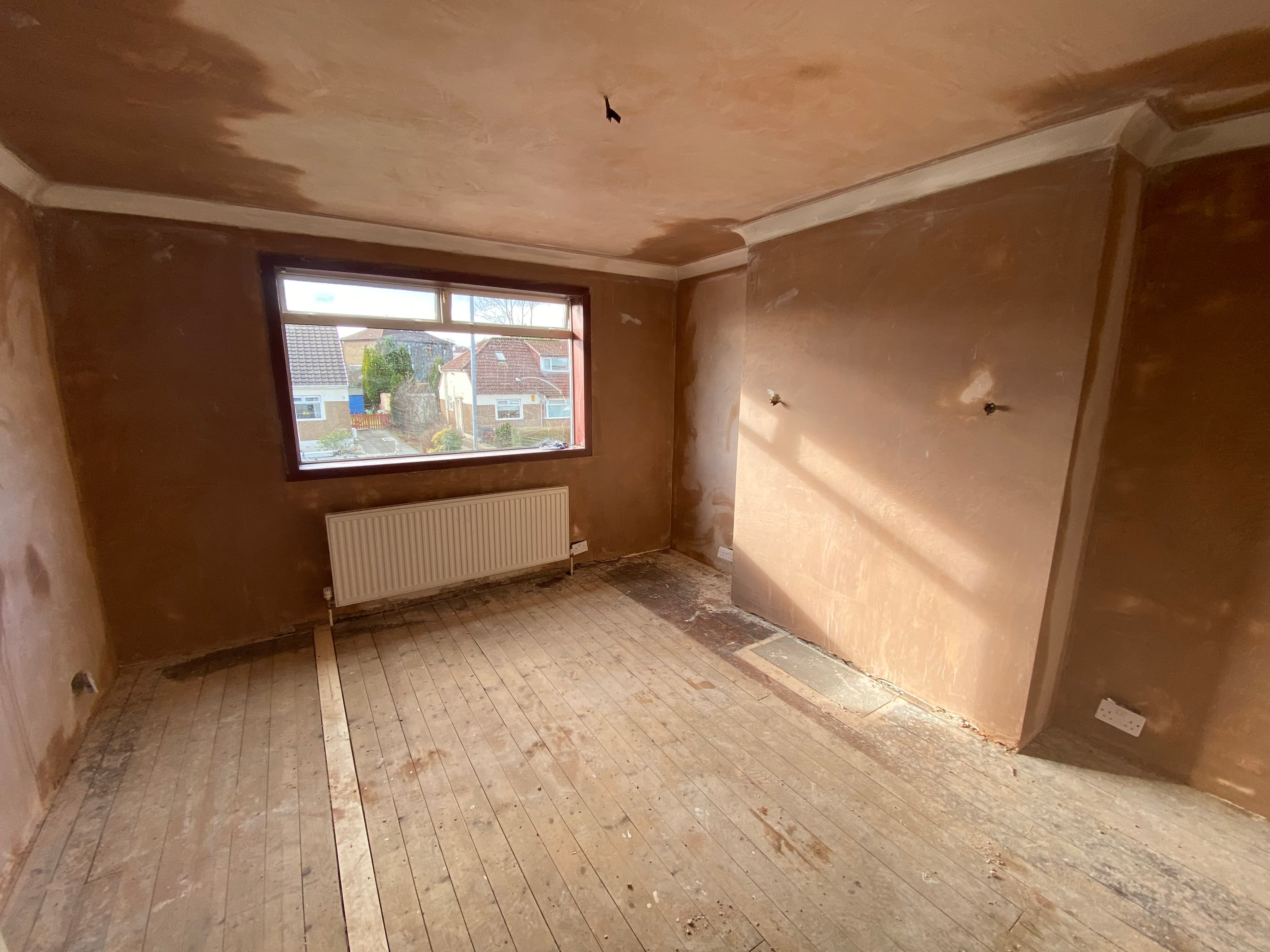 Ceiling and wall plastering after first coat