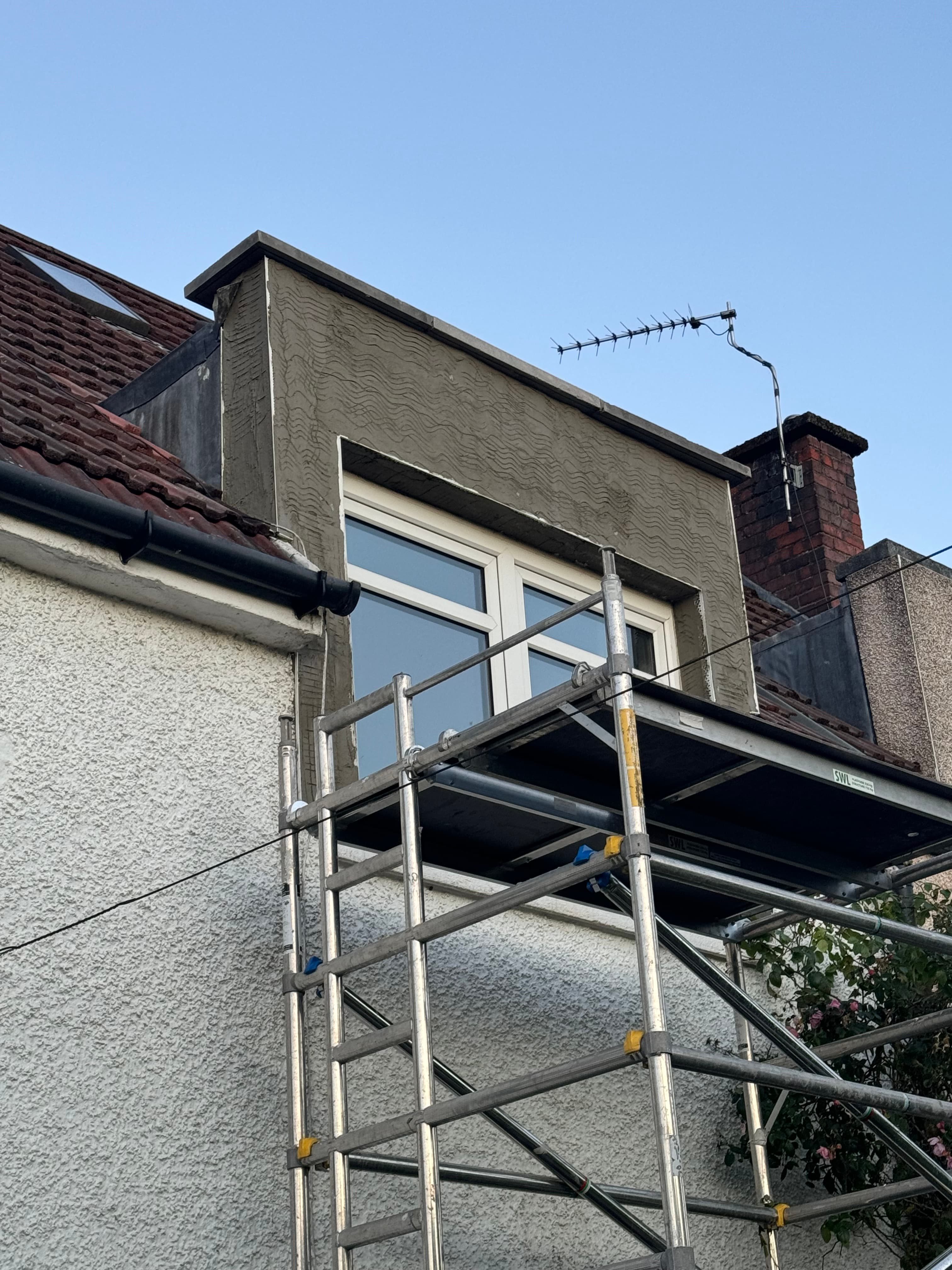 Lime render finish on masonry