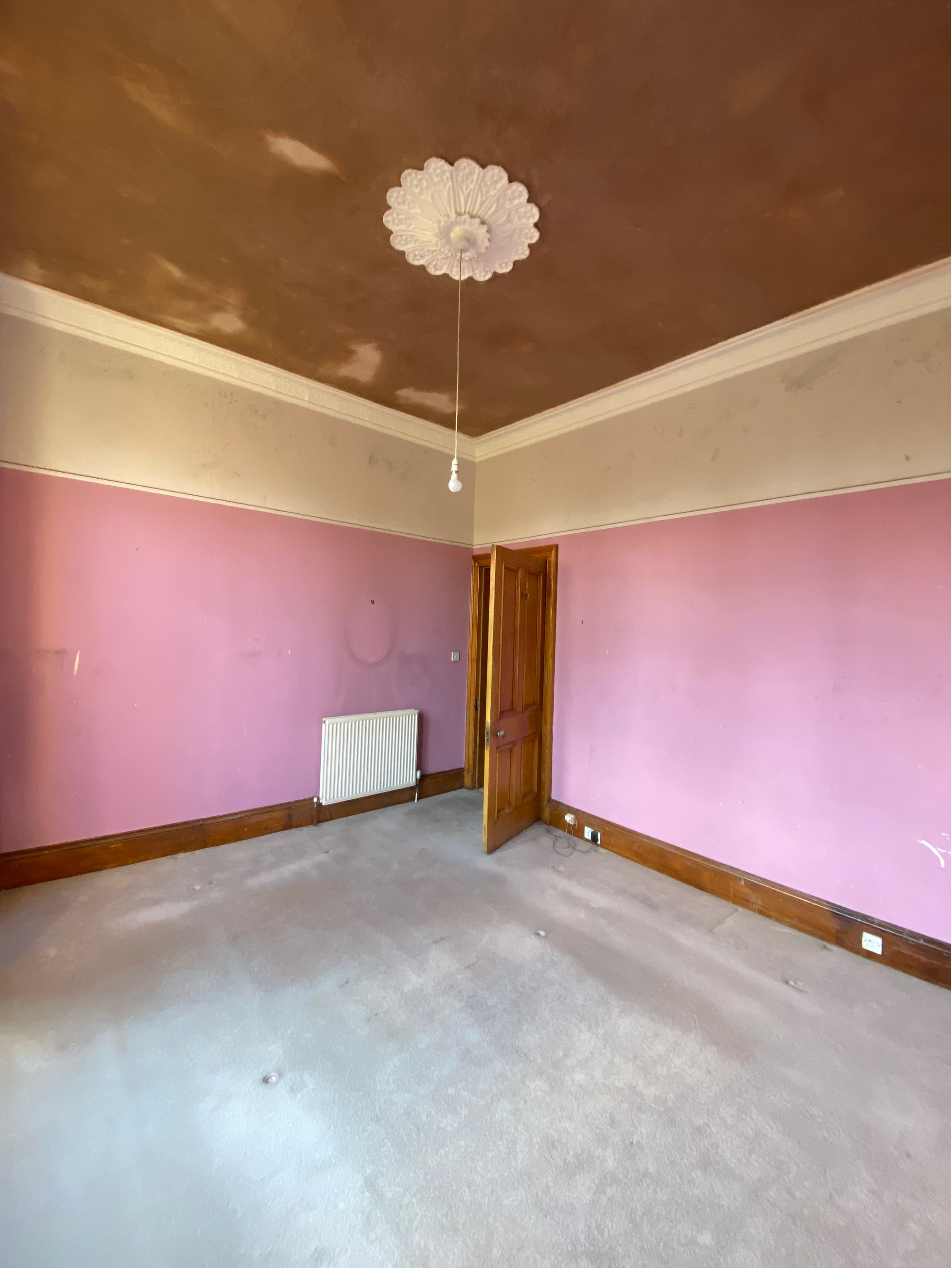 Reboarded ceiling in a refurbished room