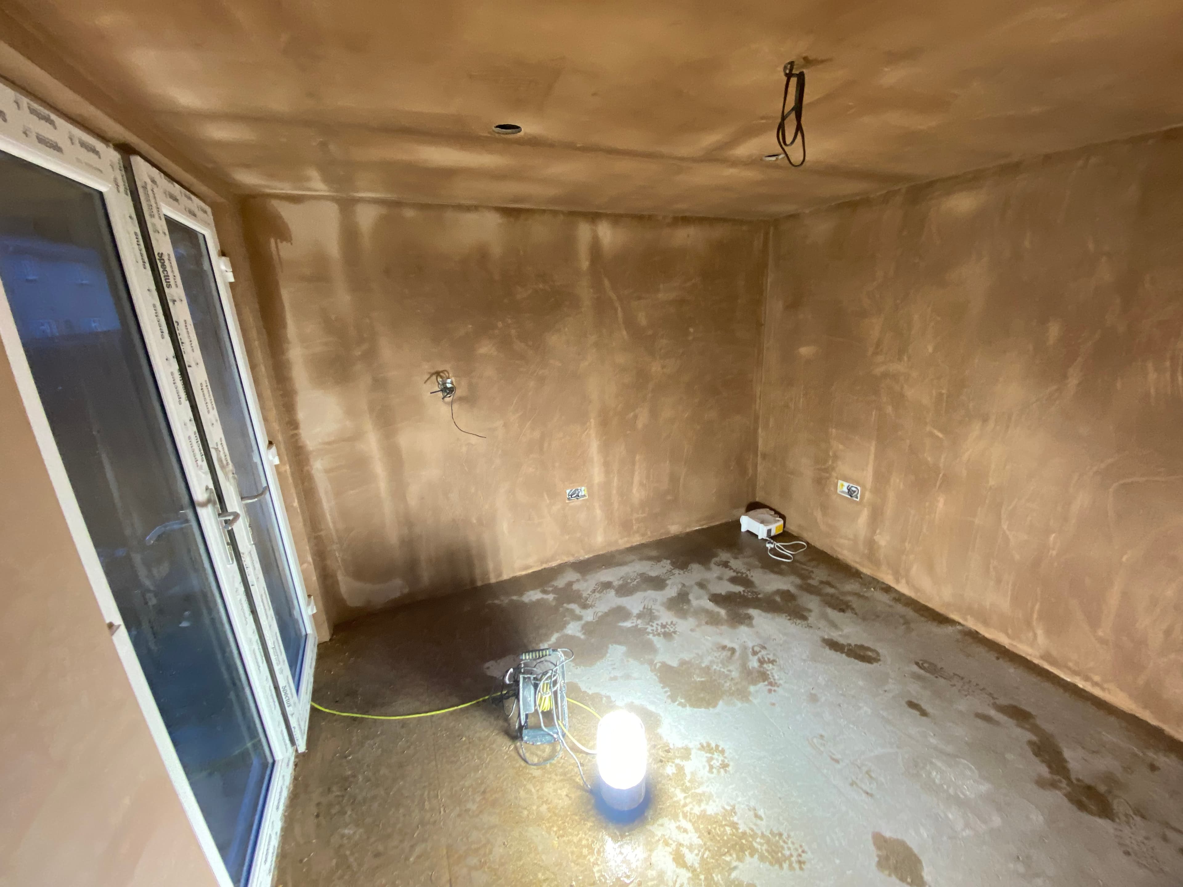 Wall plastering in a refurbished tenement